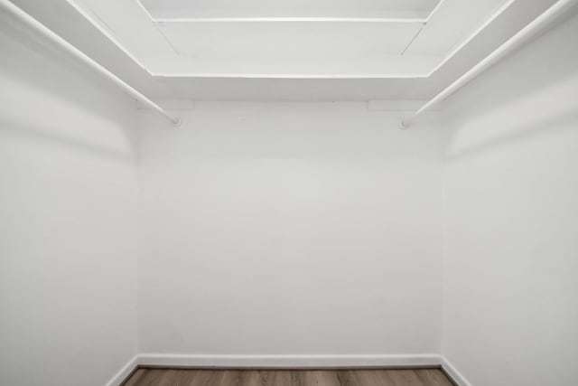 206 Hill St, Dayton, TX 77535 - spacious closet featuring wood finished floors