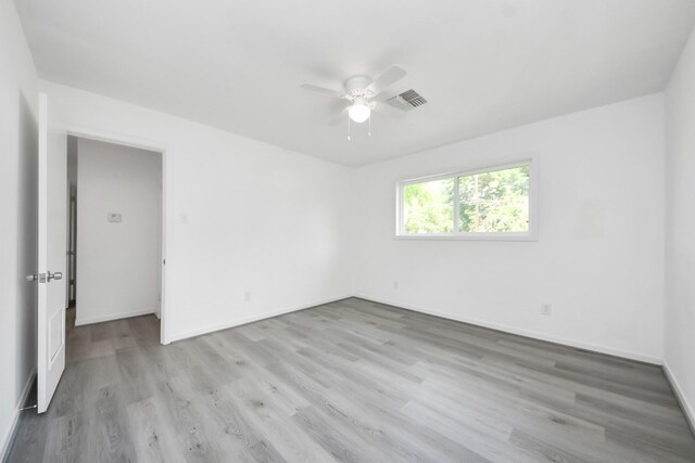 206 Hill St, Dayton, TX 77535 - empty room featuring baseboards, visible vents, ceiling fan, and light wood-type flooring