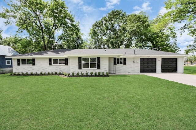 206 Hill St, Dayton, TX 77535 - single story home featuring a front lawn, driveway, and a garage