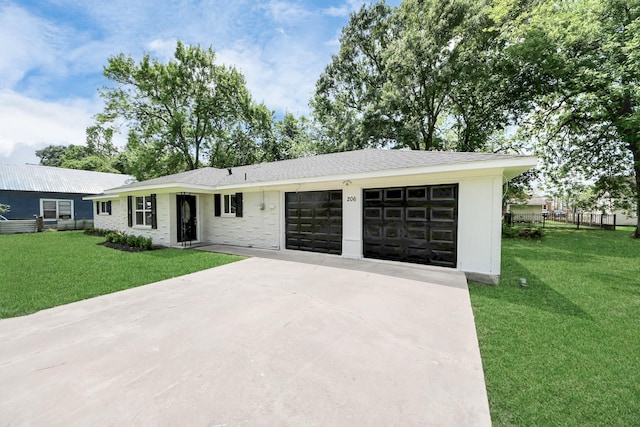 206 Hill St, Dayton, TX 77535 - ranch-style house featuring fence, a front lawn, concrete driveway, and an attached garage