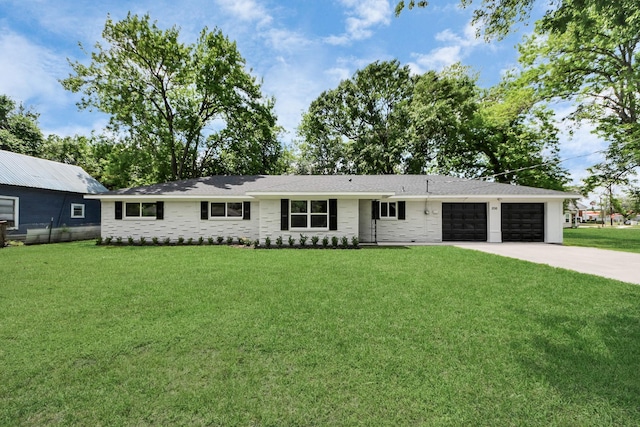 206 Hill St, Dayton, TX 77535 - single story home featuring concrete driveway, a front lawn, and a garage