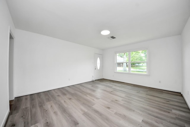 206 Hill St, Dayton, TX 77535 - empty room featuring visible vents, wood finished floors, and baseboards