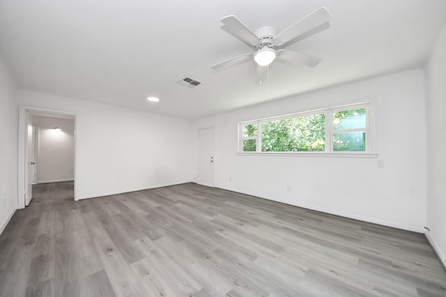 206 Hill St, Dayton, TX 77535 - unfurnished room featuring baseboards, visible vents, wood finished floors, and ceiling fan