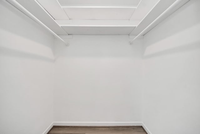 206 Hill St, Dayton, TX 77535 - walk in closet with wood finished floors