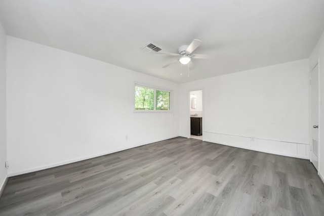 206 Hill St, Dayton, TX 77535 - unfurnished room featuring wood finished floors, visible vents, and a ceiling fan