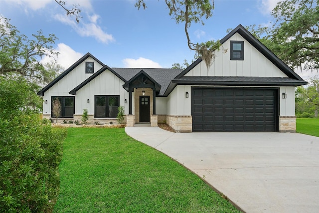 modern farmhouse featuring a front lawn, driveway, board and batten siding, and roof with shingles