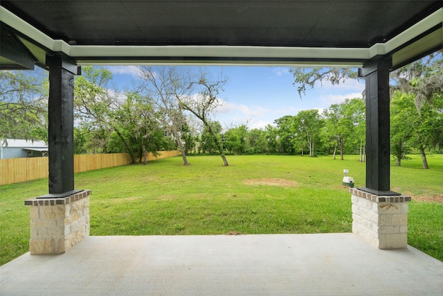 view of yard with fence and a patio area