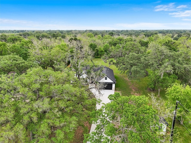 drone / aerial view with a view of trees