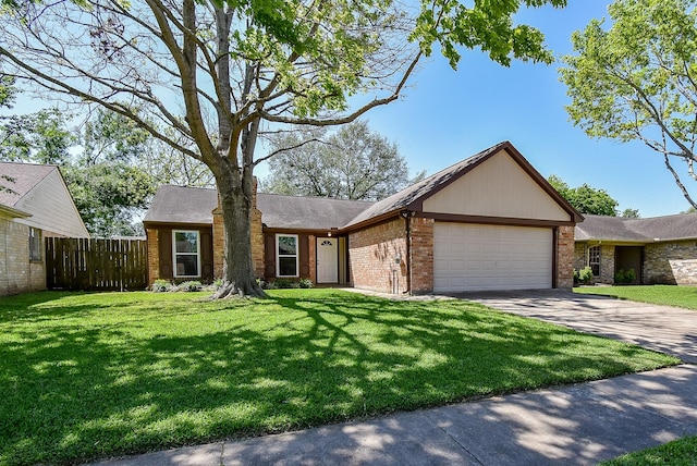ranch-style home featuring a garage, brick siding, fence, and a front yard