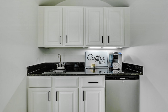 bar featuring a sink, dishwashing machine, and wet bar