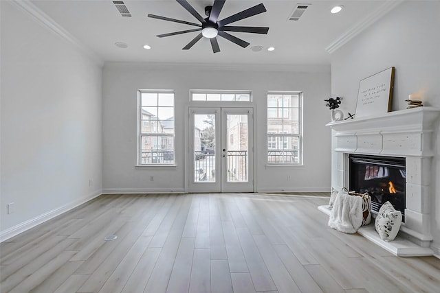 unfurnished living room featuring crown molding, visible vents, and ceiling fan