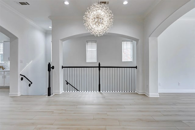 interior space featuring crown molding, recessed lighting, visible vents, and light wood-style floors