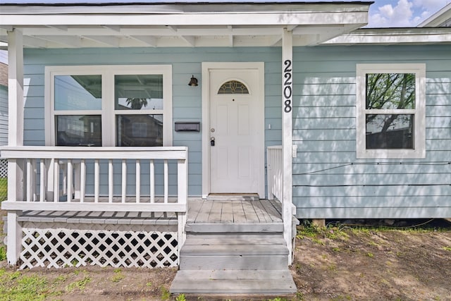 2208 Victory St, Galveston, TX 77551 - view of exterior entry featuring a porch