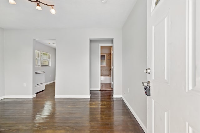 2208 Victory St, Galveston, TX 77551 - spare room with dark wood finished floors and baseboards