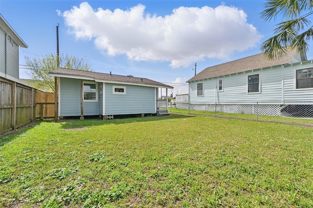 2208 Victory St, Galveston, TX 77551 - back of property with a yard and a fenced backyard