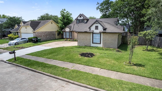 11915 Green Glade Dr, Houston, TX 77099 - view of front facade featuring a front lawn, fence, driveway, and brick siding