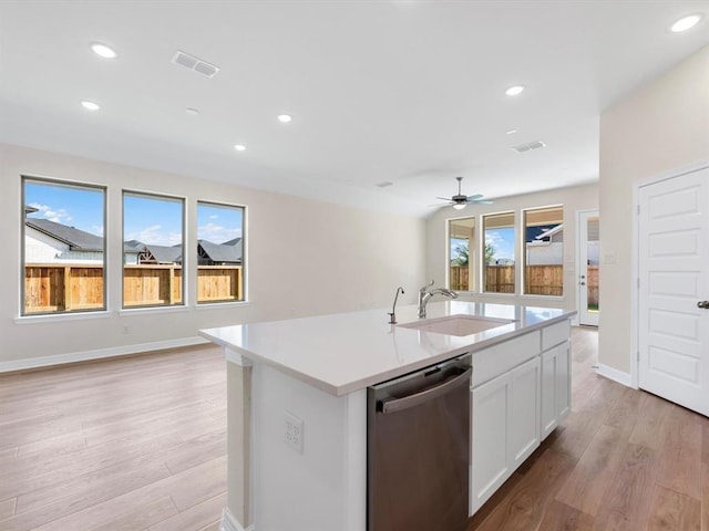 4203 Chloe Ridge Ln, Fulshear, TX 77441 - kitchen with visible vents, stainless steel dishwasher, open floor plan, and a sink