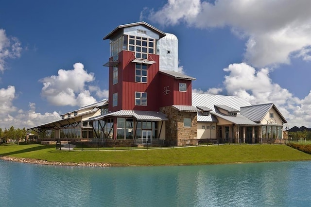 4203 Chloe Ridge Ln, Fulshear, TX 77441 - exterior space with a lawn, metal roof, and a water view