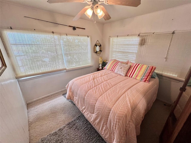 bedroom featuring ceiling fan, carpet flooring, and baseboards