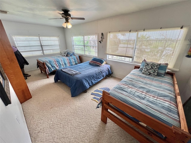 carpeted bedroom featuring a ceiling fan