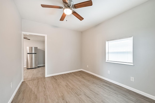 205 Prune St, La Marque, TX 77568 - empty room featuring wood finished floors, ceiling fan, and baseboards