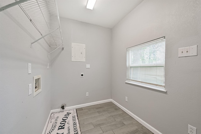 205 Prune St, La Marque, TX 77568 - laundry area with hookup for a washing machine, laundry area, electric dryer hookup, electric panel, and baseboards
