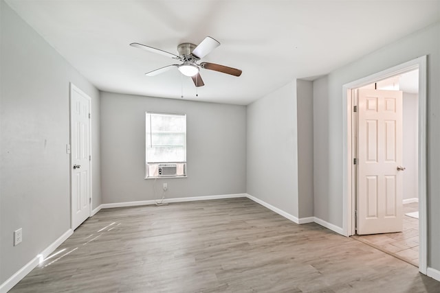 205 Prune St, La Marque, TX 77568 - unfurnished room featuring baseboards, cooling unit, wood finished floors, and a ceiling fan