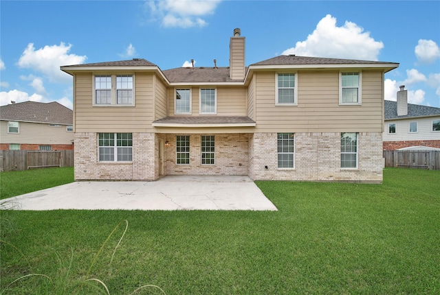 back of property featuring a lawn, a chimney, a fenced backyard, and brick siding