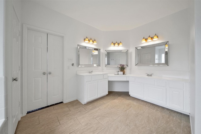 bathroom with double vanity and a sink