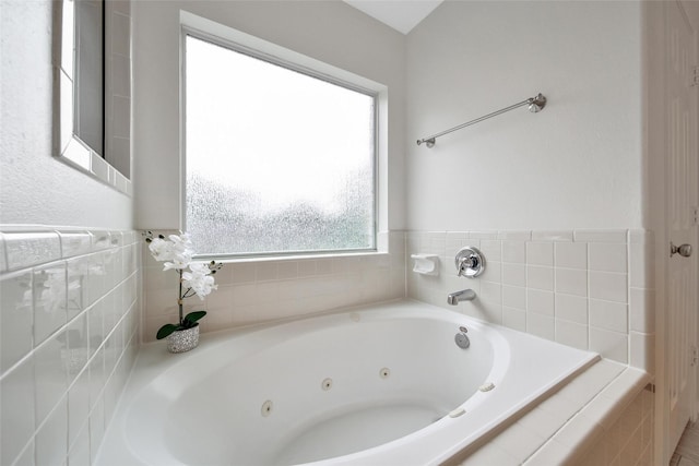 bathroom with a jetted tub
