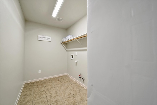 clothes washing area featuring hookup for a gas dryer, visible vents, baseboards, hookup for a washing machine, and laundry area