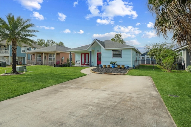 254 Debbie Ln, Dickinson, TX 77539 - ranch-style house with french doors, central AC unit, and a shingled roof