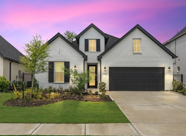 4623 Bridgewood Dr, Spring, TX 77386 - french country style house with brick siding, driveway, a front yard, and a garage