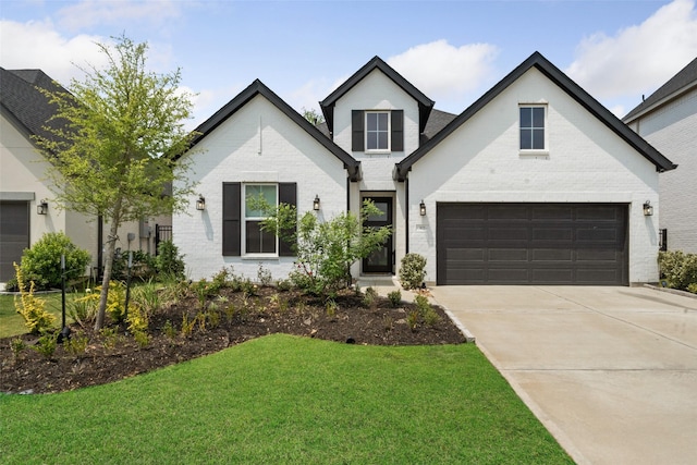 4623 Bridgewood Dr, Spring, TX 77386 - view of front of property featuring brick siding, driveway, a front yard, and an attached garage