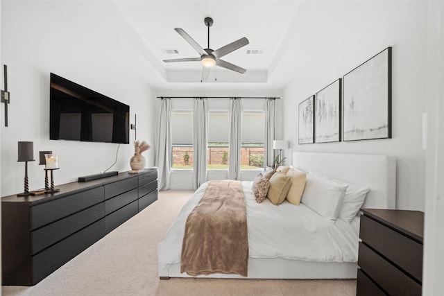 4623 Bridgewood Dr, Spring, TX 77386 - bedroom with light colored carpet, a tray ceiling, and ceiling fan