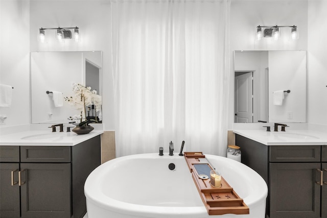 4623 Bridgewood Dr, Spring, TX 77386 - bathroom featuring a soaking tub and two vanities