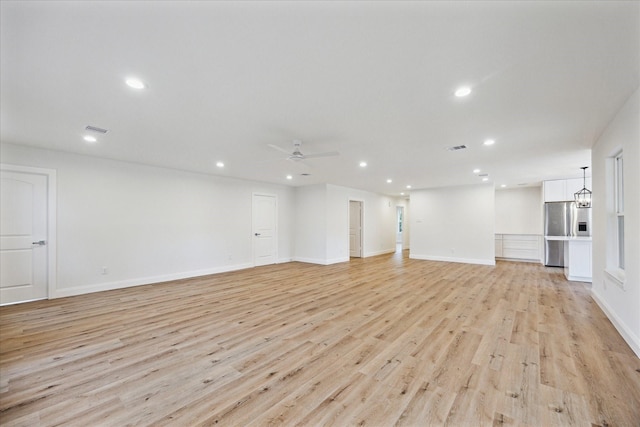 1935 Willow Rd, Wallis, TX 77485 - unfurnished living room featuring light wood-type flooring, ceiling fan, recessed lighting, and baseboards