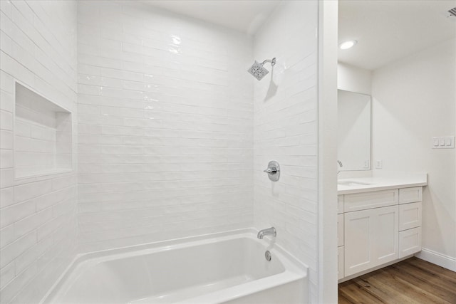 1935 Willow Rd, Wallis, TX 77485 - bathroom featuring shower / washtub combination, wood finished floors, vanity, and baseboards
