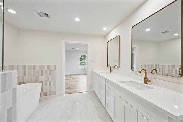 1935 Willow Rd, Wallis, TX 77485 - full bath with recessed lighting, visible vents, marble finish floor, and a sink