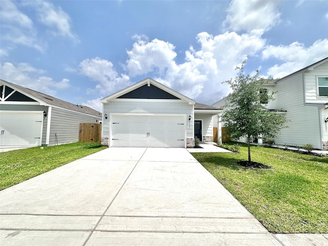 single story home featuring a front lawn, stone siding, concrete driveway, an attached garage, and fence