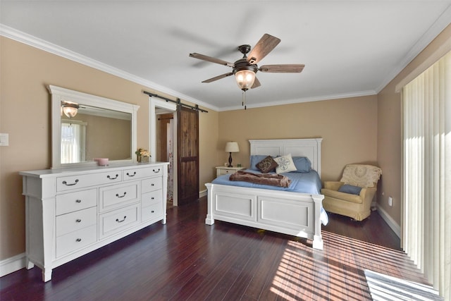 bedroom with baseboards, a barn door, dark wood finished floors, and ornamental molding