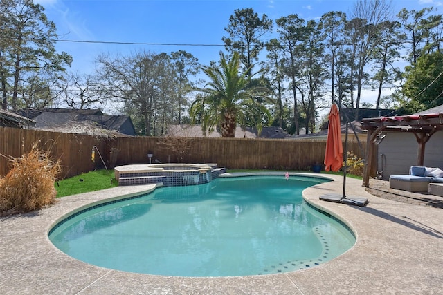 view of pool with a fenced backyard, a pool with connected hot tub, and a patio area