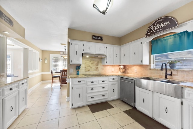 kitchen with under cabinet range hood, white cabinets, light tile patterned floors, and dishwasher