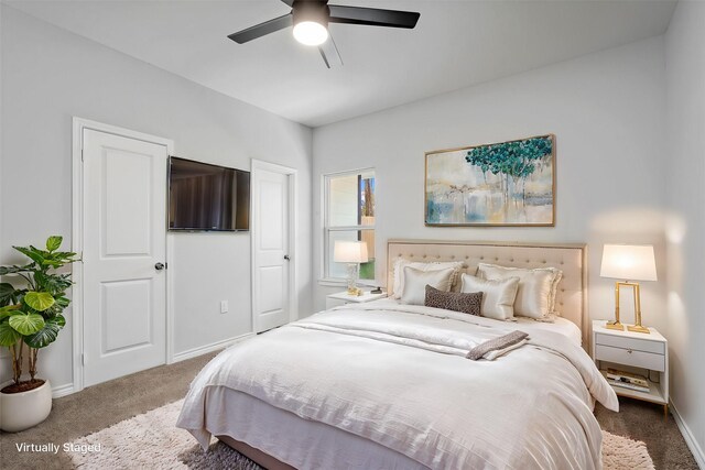 carpeted bedroom with baseboards and ceiling fan