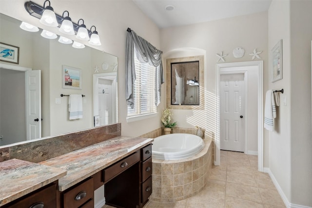full bath with tile patterned floors, a garden tub, vanity, and walk in shower