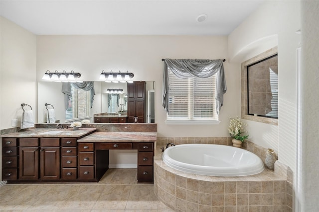 full bathroom with a bath, tile patterned floors, and vanity