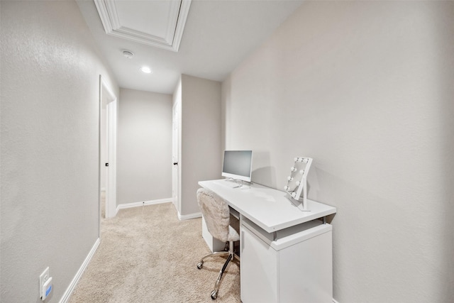 home office featuring baseboards and light carpet