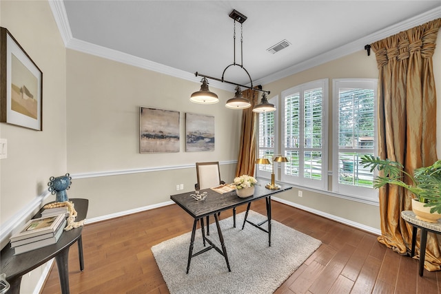 office area featuring baseboards, visible vents, ornamental molding, and wood finished floors