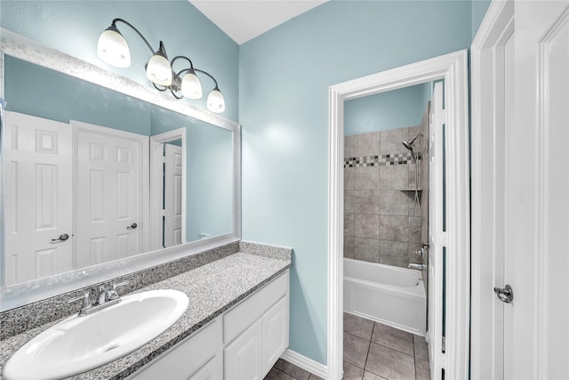 full bathroom with vanity, tile patterned flooring, washtub / shower combination, and baseboards