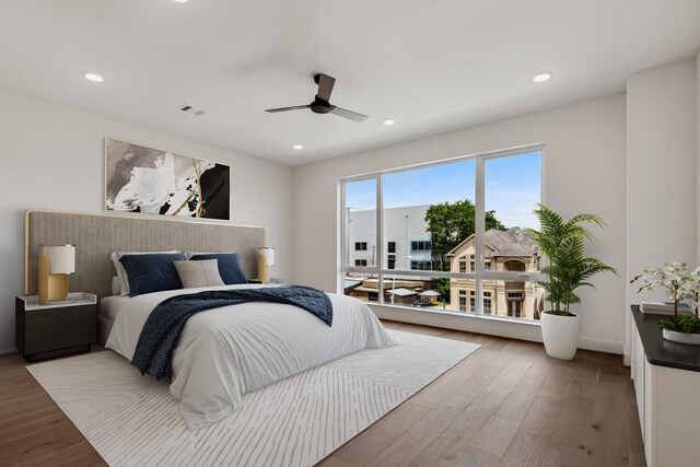 4705 Gibson St, Houston, TX 77007 - bedroom featuring wood finished floors, recessed lighting, ceiling fan, and baseboards